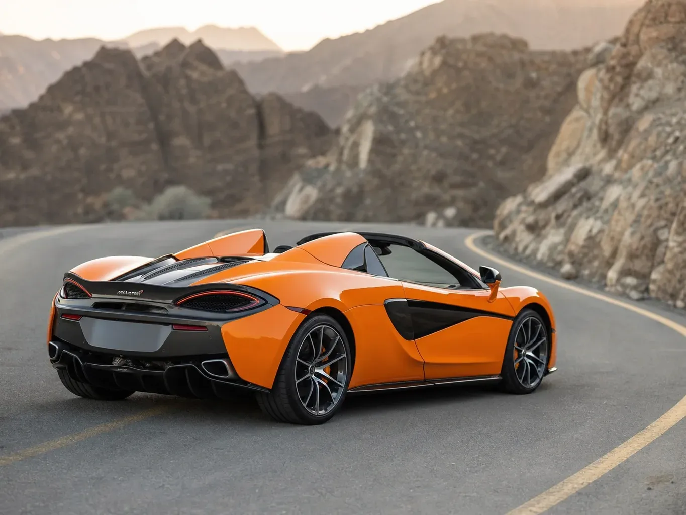 McLaren 570S Spyder Orange rear three-quarter view